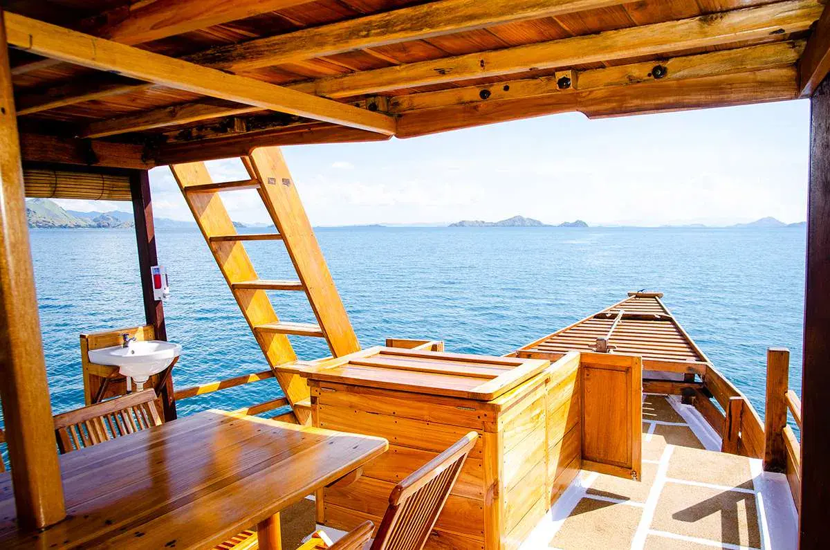Nusantara’s open-air wooden dining area overlooking the sea